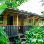 Home/Our Cabins: veranda looking into garden